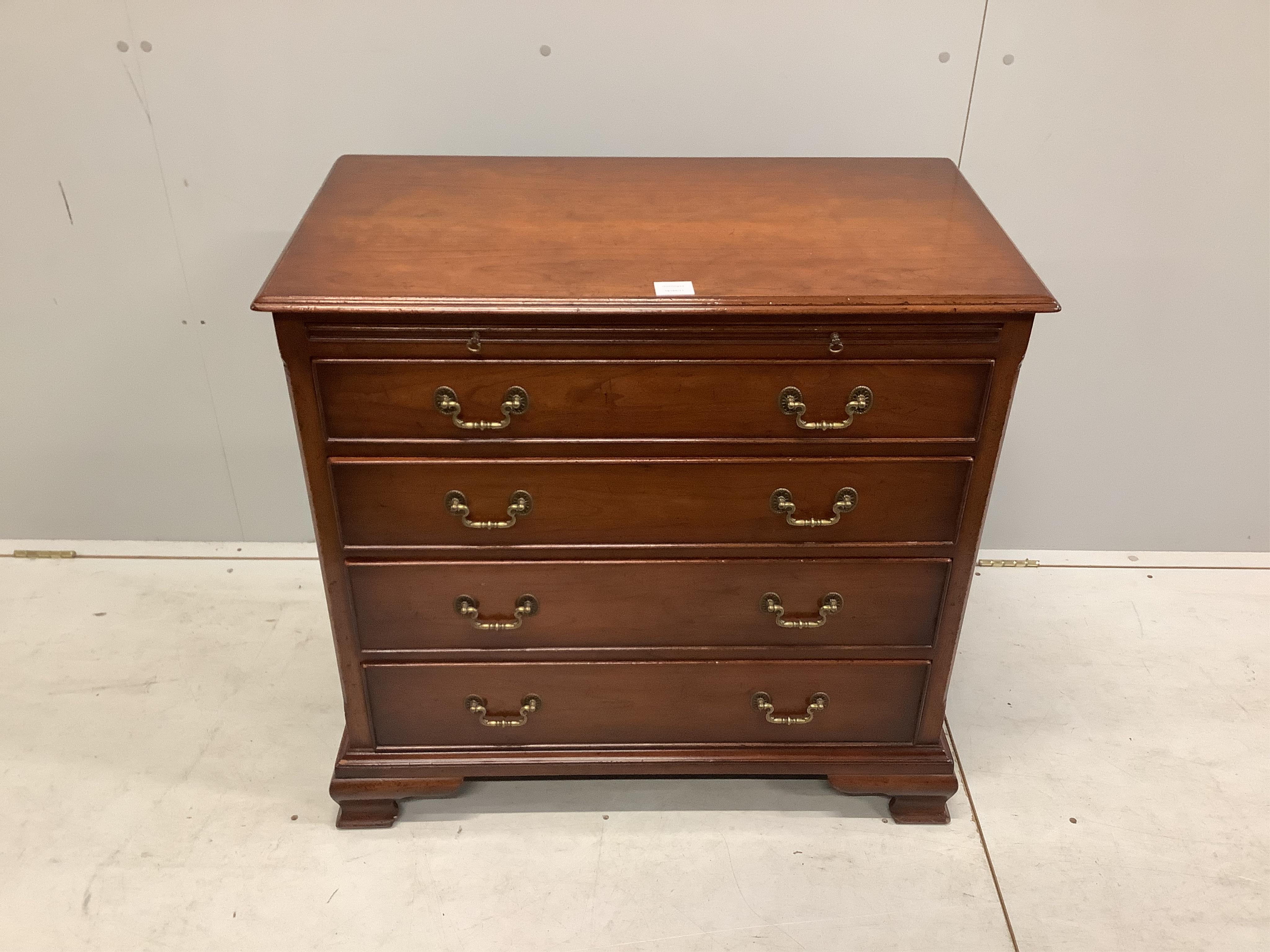 A George III style mahogany chest, fitted four long drawers, beneath a brushing slide, width 84cm, depth 45cm, height 80cm. Condition - good